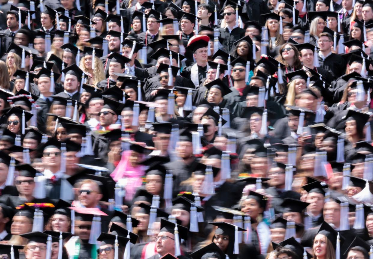 Graduates sway as they sing "Carmen Ohio" during Spring Commencement on Sunday, May 5, 2019 at Ohio State University in Columbus, Ohio. 