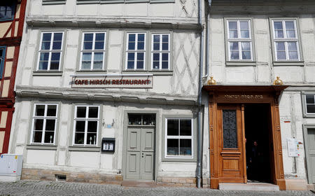 The cafe Hirsch restaurant is pictured beside the former entrance to a synagogue in Halberstadt, Germany, May 4, 2019. Picture taken May 4, 2019. REUTERS/Fabrizio Bensch