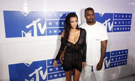 Kim Kardashian and Kanye West arrive at the 2016 MTV Video Music Awards in New York, U.S., August 28, 2016. REUTERS/Lucas Jackson