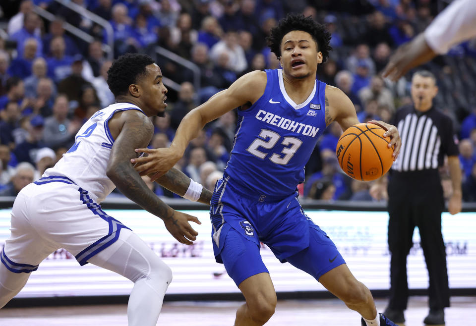 Creighton guard Trey Alexander (23) drives to the basket against Seton Hall guard Al-Amir Dawes (2) during the first half of an NCAA college basketball game in Newark, N.J. Saturday, Jan. 20, 2024. (AP Photo/Noah K. Murray)