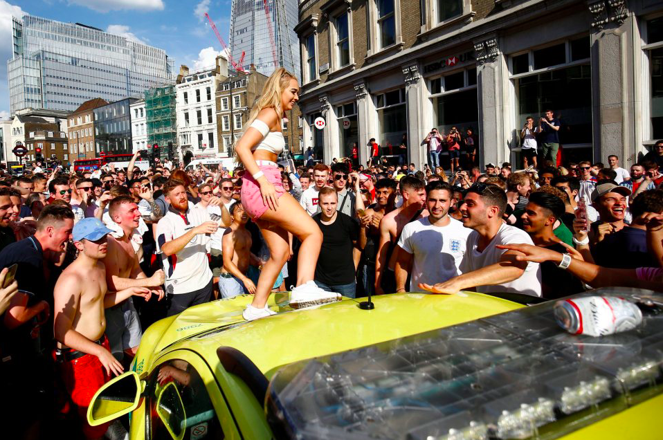 <em>The woman appeared to stomp on the dented ambulance after England beat Sweden in the World Cup (Reuters)</em>