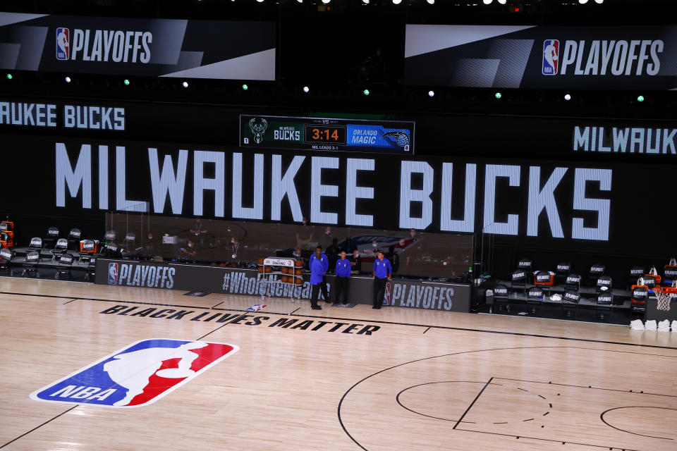 LAKE BUENA VISTA, FLORIDA - AUGUST 26: Referees stand on an empty court before the start of a scheduled game between the Milwaukee Bucks and the Orlando Magic for Game Five of the Eastern Conference First Round during the 2020 NBA Playoffs at AdventHealth Arena at ESPN Wide World Of Sports Complex on August 26, 2020 in Lake Buena Vista, Florida. NOTE TO USER: User expressly acknowledges and agrees that, by downloading and or using this photograph, User is consenting to the terms and conditions of the Getty Images License Agreement. (Photo by Kevin C. Cox/Getty Images)