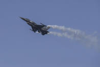 A Hellenic Air Force F-16 takes part at the annual military parade at the northern port city of Thessaloniki, Greece, on Thursday, Oct. 28, 2021 .The parade is held to celebrate Greece's refusal to align itself with a belligerent fascist Italy in 1940 and instead fight a much stronger opponent, a decision which dragged it into World War II and eventually led to a brutal occupation by Nazi Germany. (AP Photo/Giannis Papanikos)