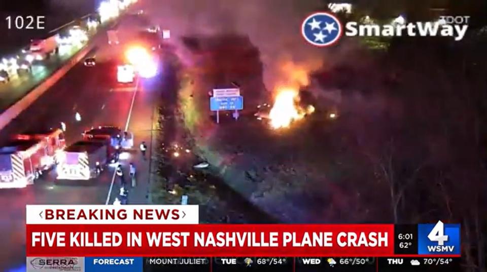 Flames seen at the side of the I-40 in Nashville, Tennessee following the plane crash (WSMV 4)