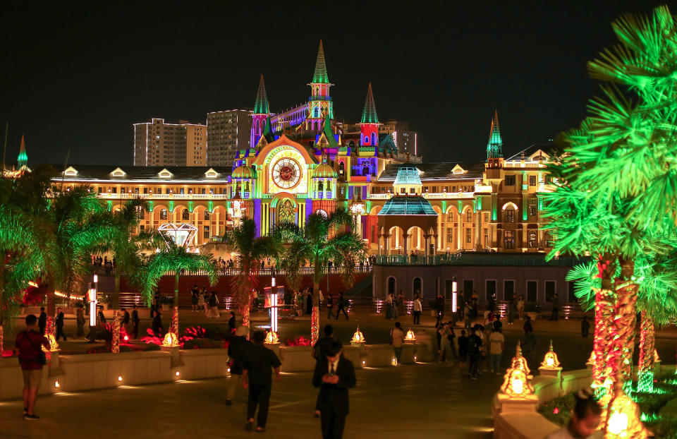 Visitors stroll around the Kings Romans Casino complex in Bokeo, Laos, in the Golden Triangle Economic Zone, on Jan. 25.<span class="copyright">Pongmanat Tasiri—SOPA Images/LightRocket/Getty Images</span>