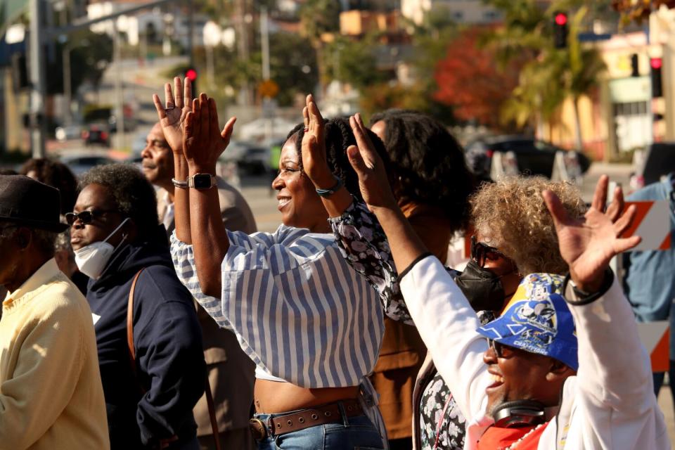 People cheer for L.A. Mayor-elect Karen Bass at a "homecoming" event Saturday in Leimert Park.