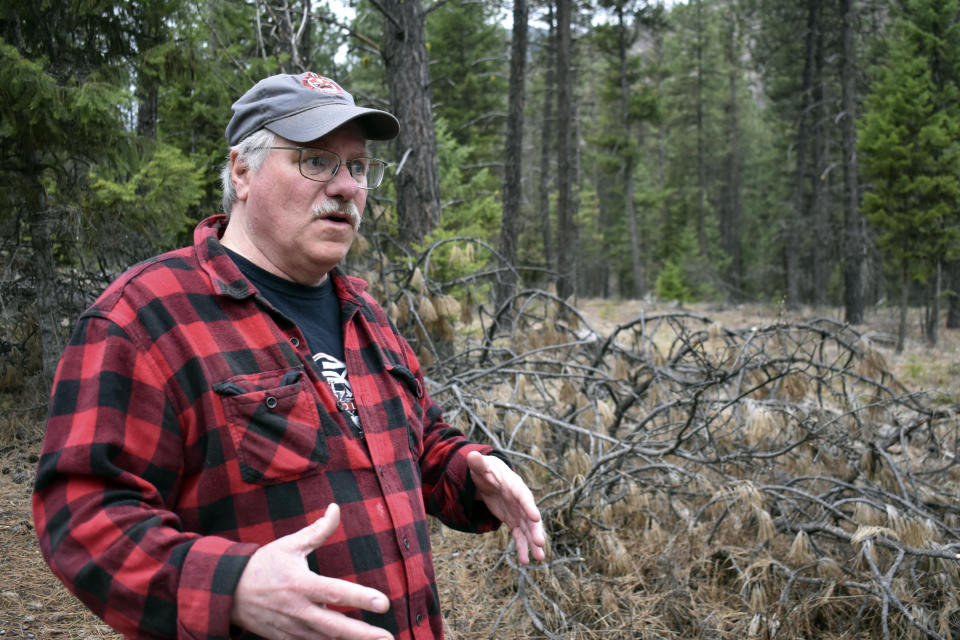 Paul Resch is seen speaking about growing up in northwestern Montana, on Thursday, April 4, 2024, near Libby, Mont. Resch is among thousands of people diagnosed with asbestos-related diseases from contaminated vermiculite that was mined near Libby. The material was shipped by rail to destinations across the U.S. for use as insulation. (AP Photo/Matthew Brown)