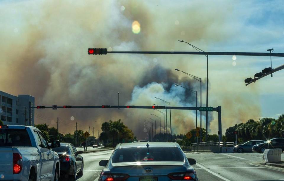 View of heavy smoke caused by a grass fire at SW 137 Avenue and 8 Street in Miami, on Sunday, April 14, 2024. Pedro Portal/pportal@miamiherald.com