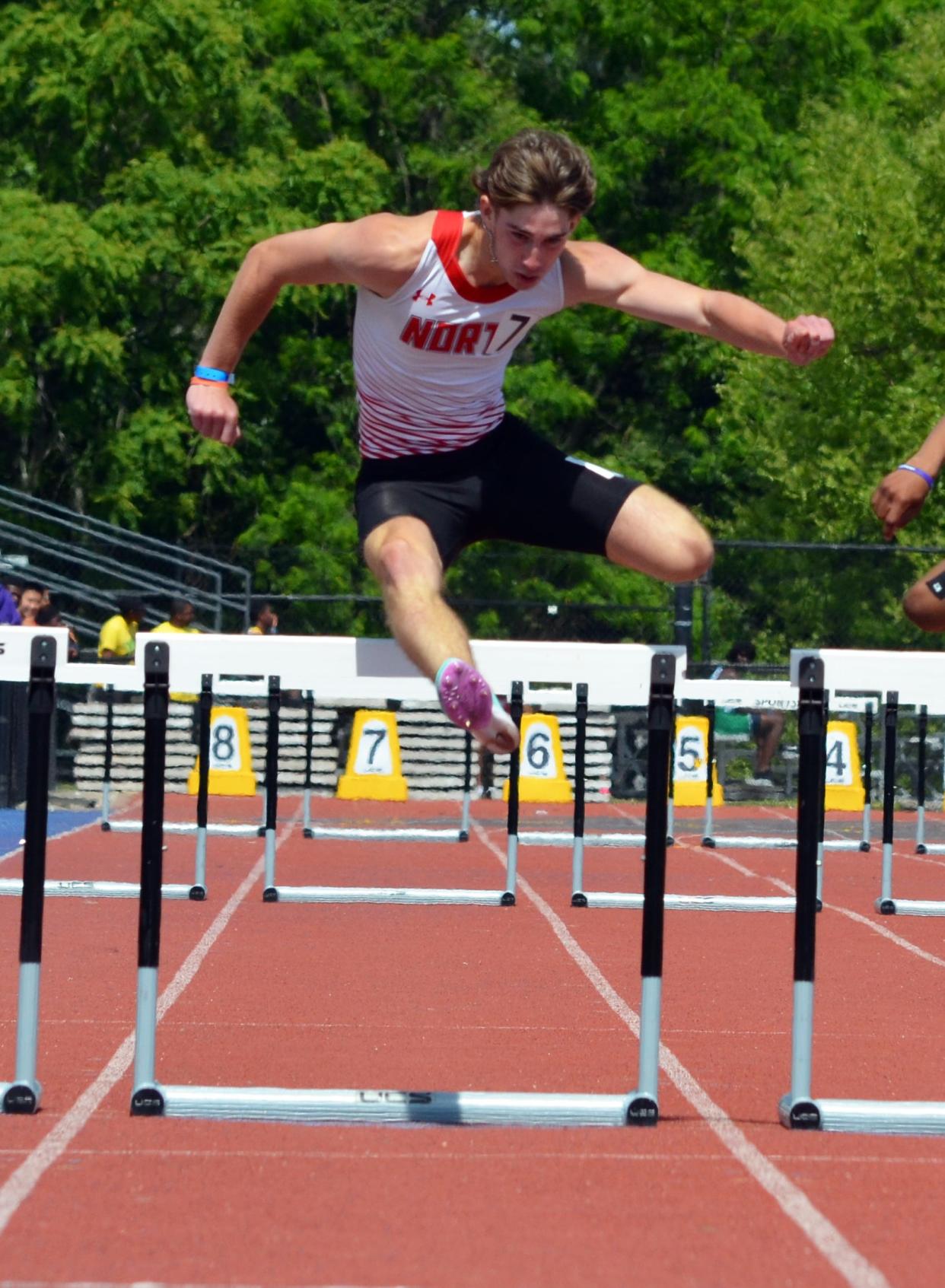 North Hagerstown's Ryder Johnston clears the final hurdle on his way to a school record in the 110 hurdles at last year's state championships.