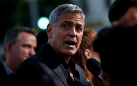 FILE PHOTO: Director George Clooney is interviewed at the premiere for "Suburbicon" in Los Angeles, California, U.S., October 22, 2017. REUTERS/Mario Anzuoni/File Photo