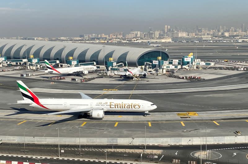 FILE PHOTO: Emirates airliners are seen on the tarmac in a general view of Dubai International Airport