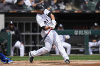 Chicago White Sox's Paul DeJong hits a home run during the second inning of the first baseball game of a doubleheader against the Kansas City Royals, Wednesday, April 17, 2024, in Chicago. (AP Photo/Erin Hooley)