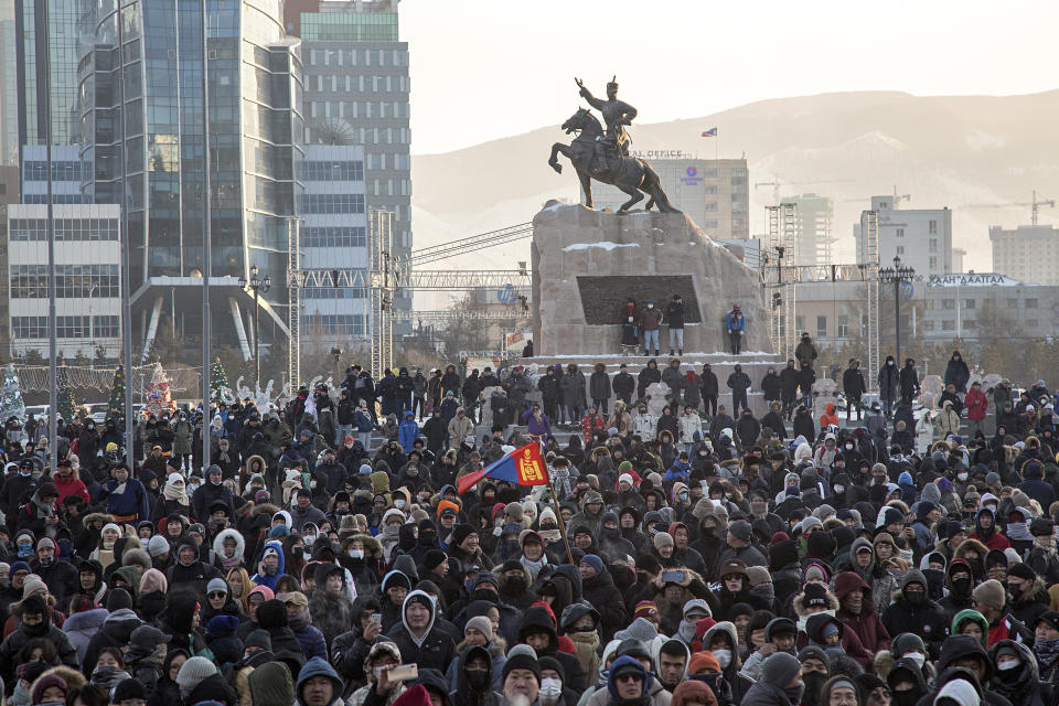 Protesters gather on Sukhbaatar Square in Ulaanbaatar in Mongolia on Monday, Dec. 5, 2022. Protesters angered by allegations of corruption linked to Mongolia's coal trade with China have stormed the State Palace in the capital, demanding dismissals of officials involved in the scandal. (AP Photo/Alexander Nikolskiy)
