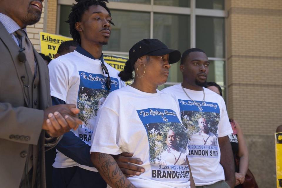 Brionne Mays, brother of Brandon Smith, holds his mother Yolanda Ford during a Black Lives Matter rally held outside Sacramento City Hall in 2018. Smith died in Sacramento Police custody the week before, and the city has not released and disciplinary information.