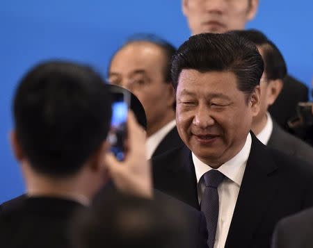 China's President Xi Jinping is photographed by a smartphone at the opening ceremony of the fifth regular foreign ministers' meeting of the Conference on Interaction and Confidence Building Measures in Asia (CICA) at the Diaoyutai State Guesthouse in Beijing Apr28, 2016. REUTERS/KYODO NEWS/IORI SAGISAWA/POOL