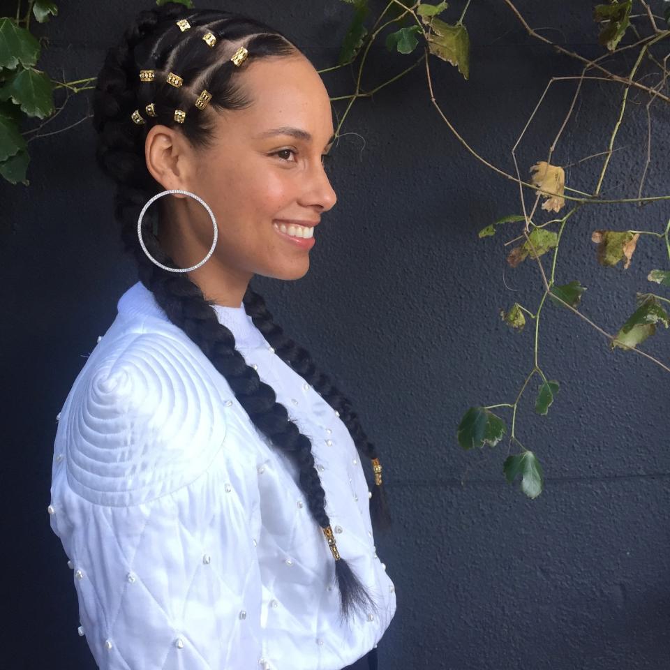 Hair cuffs are another cool way to add interest. Alicia Keys's braids are a case in point.