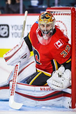 FILE PHOTO: Sep 18, 2017; Calgary, Alberta, CAN; Calgary Flames goalie Jon Gillies (32) defends the goal against the Edmonton Oilers during the second period at Scotiabank Saddledome. Sergei Belski-USA TODAY Sports