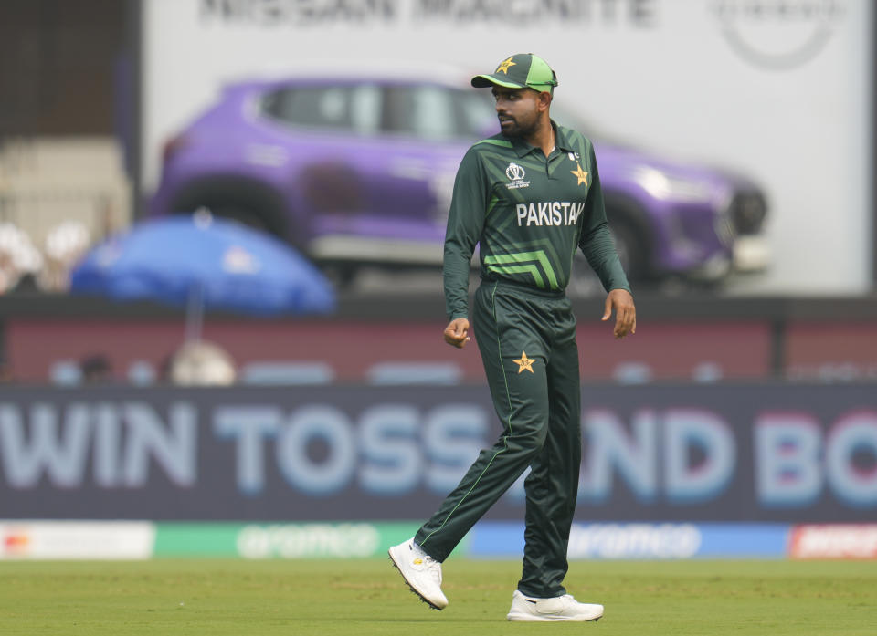 Pakistan's captain Babar Azam leaves after the coin toss during the ICC Men's Cricket World Cup match between India and Pakistan in Ahmedabad, India, Saturday, Oct. 14, 2023. (AP Photo/Aijaz Rahi)