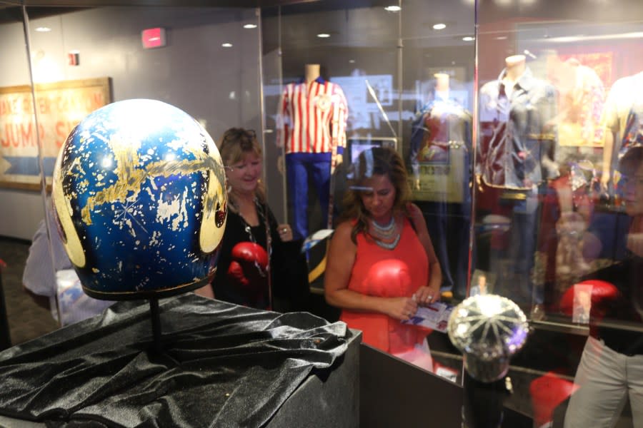 Chris Keeshan and Carla Bowhay look at a helmet and other items on display at the Evel Knievel Museum in Topeka on June 21, 2017. (Photo credit should read BETH LIPOFF/AFP via Getty Images)