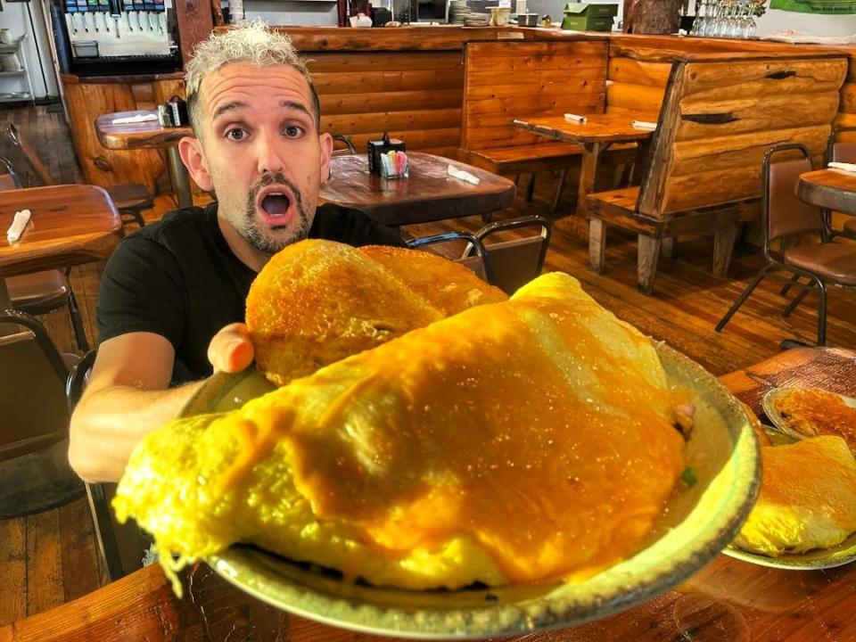 Abraham Reynaga of the YouTube channel ShastaFood, shows The Big One, a 12-egg omelet that's one of the eating challenges at the Old Mill Eatery & Smokehouse. Reynaga finished the omelet and sides in a record time of 6 minutes, 35 seconds, in November 2022.