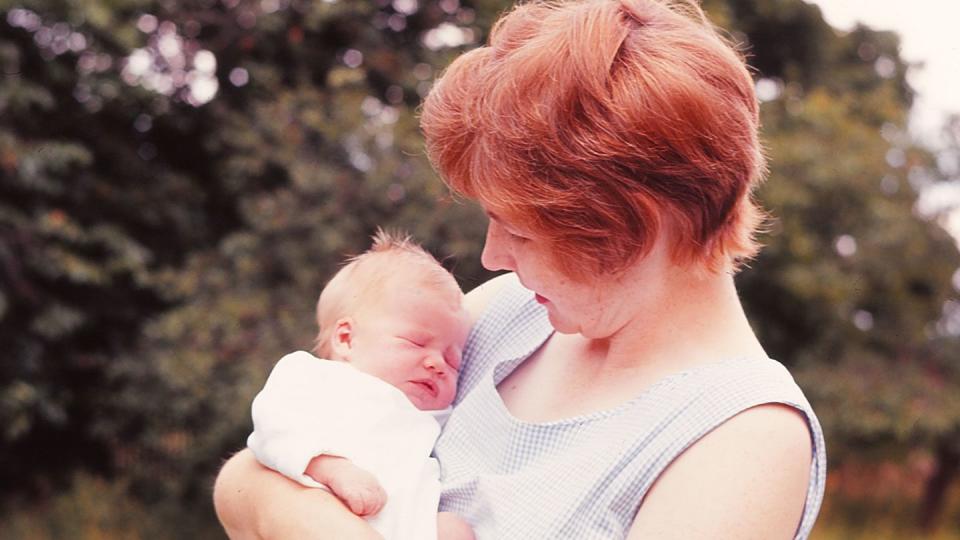 mother holding her newborn baby girl