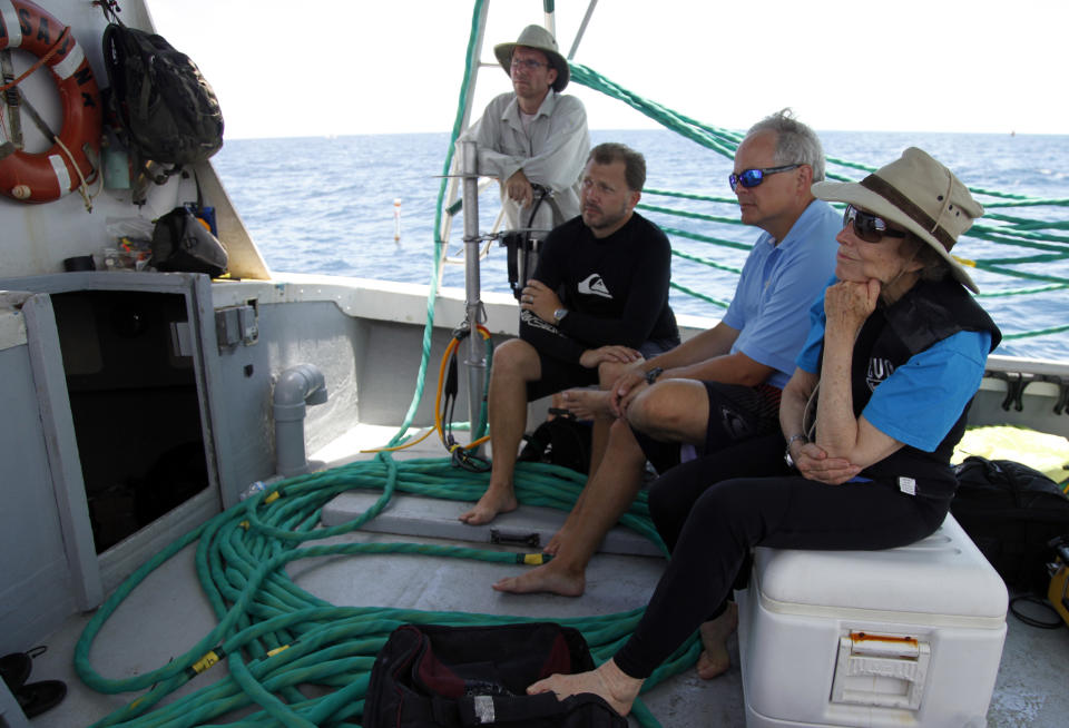 Sylvia Earle, right, listens to a briefing before a dive to the undersea research laboratory Aquarius Reef Base, Friday, July 13, 2012, in the Florida Keys. Also pictured from left to right are Dale Stokes, D.J. Roller, and Mark Patterson. NOAA owns the lab that has rested for decades some 60 feet below the water’s surface on the Conch Reef in the Florida Keys National Marine Sanctuary. But federal budget cuts threaten to close the undersea lab unless it can secure private funding. (AP Photo/Lynne Sladky)