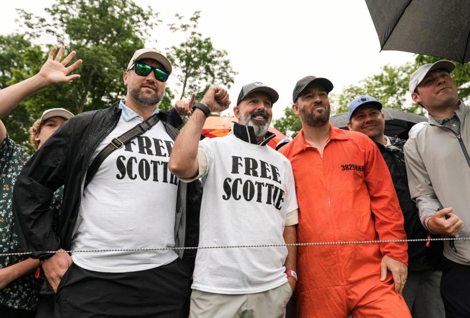 Spectators wore Free Scottie t-shirts and one wore an orange jumpsuit like shown in the Louisville Metro Corrections mug shot of Scottie Scheffler at the 2024 PGA Championship second round on 17 May (USA TODAY Sports via Reuters Con)