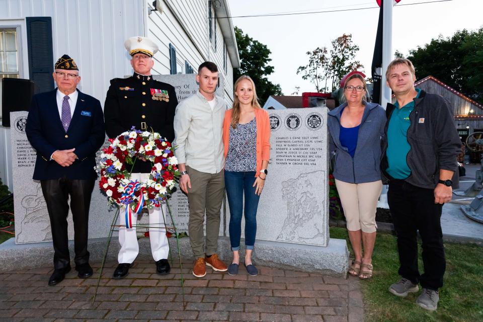 Tanner Grone's family - mother and father Erica and Steve, sister Emily and her husband Mike Lemoine - stand with Post 35 Commander Berk Bennett (left) and guest speaker Col. Charles Nicol, USMC, during the 