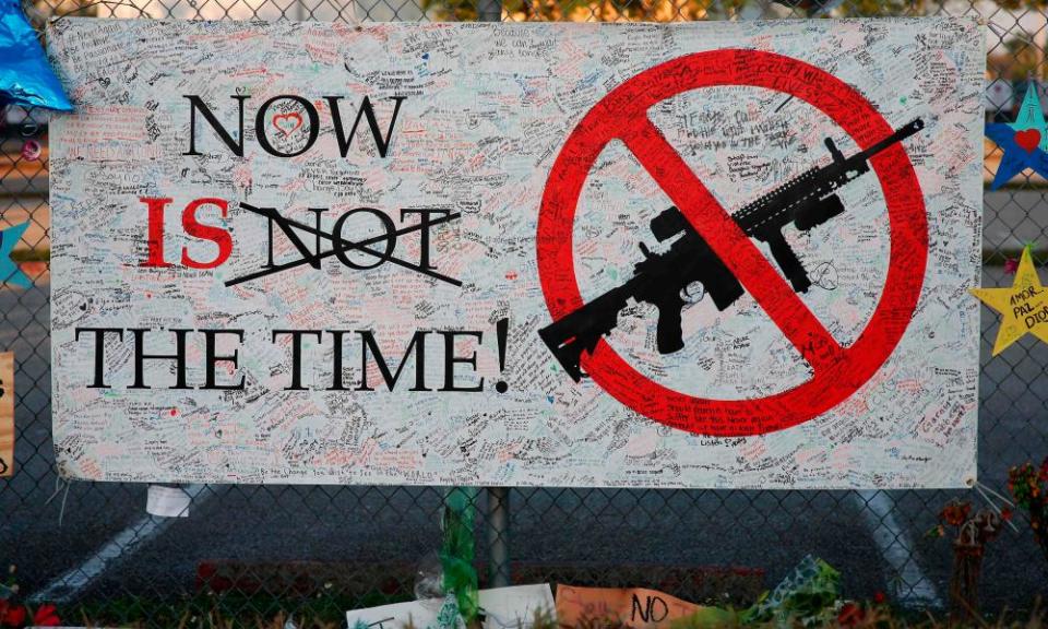 A sign hangs on a fence at Marjory Stoneman Douglas high school in Parkland, Florida, following the mass shooting there earlier this month.
