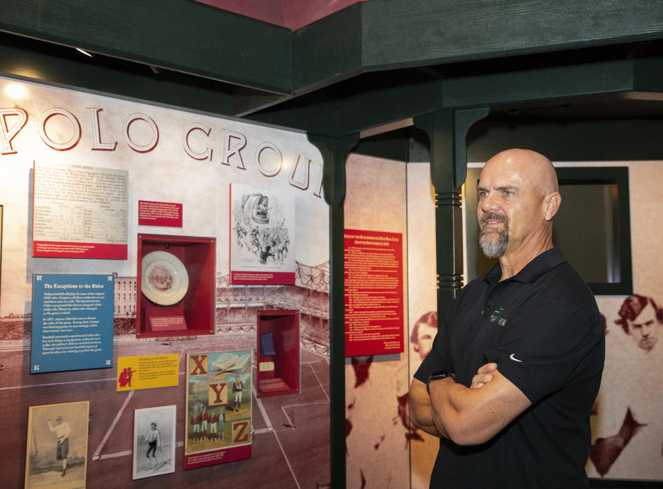 In this photo provided by the National Baseball Hall of Fame and Museum, Larry Walker tours of the of the National Baseball Hall of Fame and Museum, Tuesday, Feb. 25, 2020, in Cooperstown, N.Y. Walker said on Tuesday that his Hall of Fame plaque will show him in Colorado Rockies cap, not a Montreal Expos hat. He added the key to picking the Rockies is that Colorado was "where the majority of my damage was done." (Milo Stewart, Jr./National Baseball Hall of Fame and Museum via AP)