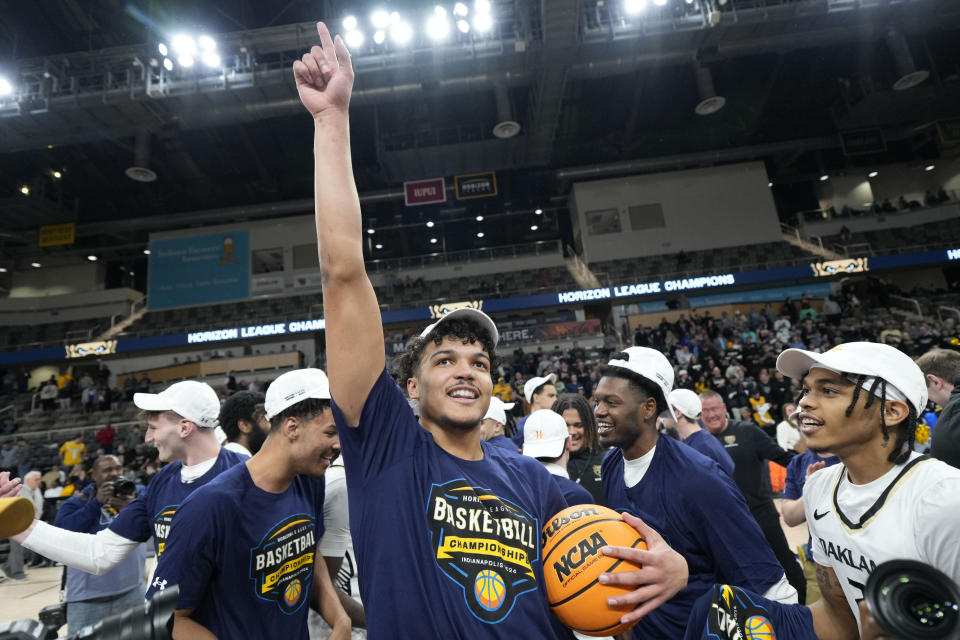 CORRECTS TO TREY TOWNSEND, INTEAD OF BLAKE LAMPMAN - Oakland forward Trey Townsend celebrates after Oakland defeated Milwaukee in an NCAA college basketball game for the Horizon League men's tournament championship, Tuesday, March 12, 2024, in Indianapolis. (AP Photo/AJ Mast)