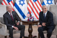 President Joe Biden, left, and Israeli Prime Minister Yair Lapid address the media following their meeting in Jerusalem Thursday, July 14, 2022. (AP Photo/Evan Vucci)