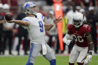 Detroit Lions quarterback Matthew Stafford (9) shows as Arizona Cardinals free safety D.J. Swearinger (36) pursues during the second half of an NFL football game, Sunday, Sept. 8, 2019, in Glendale, Ariz. (AP Photo/Darryl Webb)
