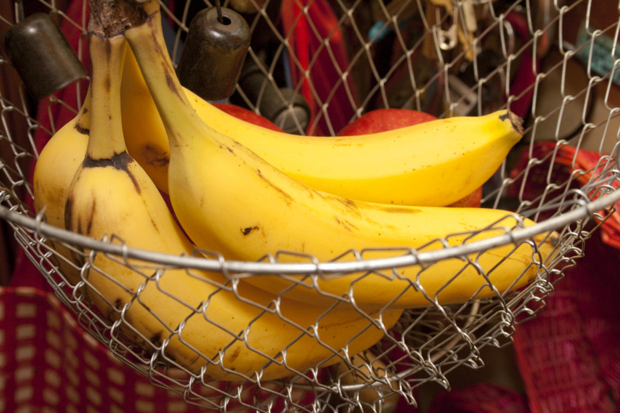 Yellow bananas in a kitchen basket