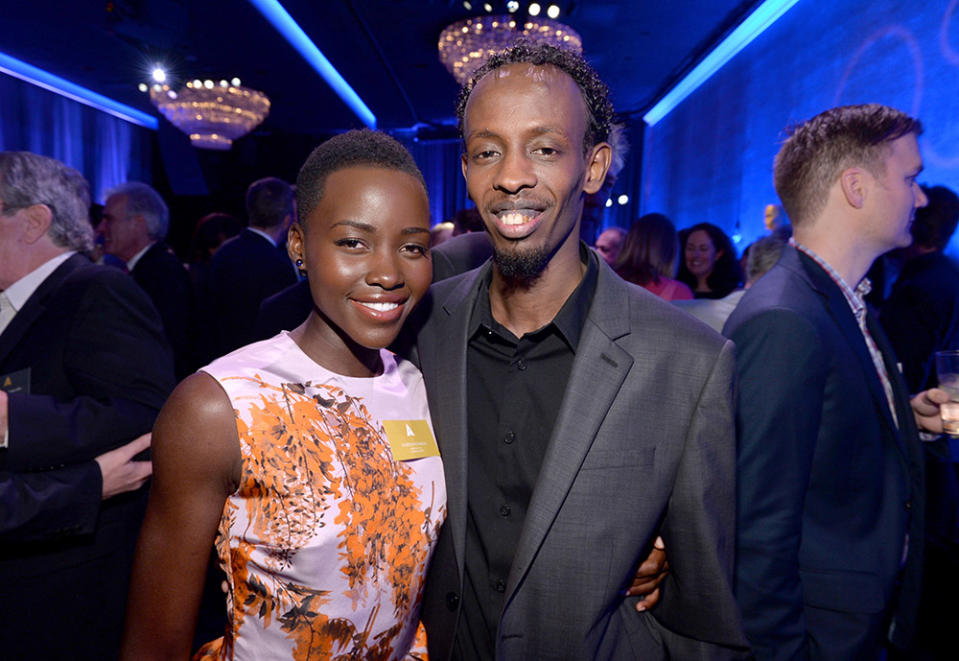 Actress Lupita Nyong'o (L) and actor Barkhad Abdi attend the 86th Academy Awards nominee luncheon at The Beverly Hilton Hotel on February 10, 2014 in Beverly Hills, California.