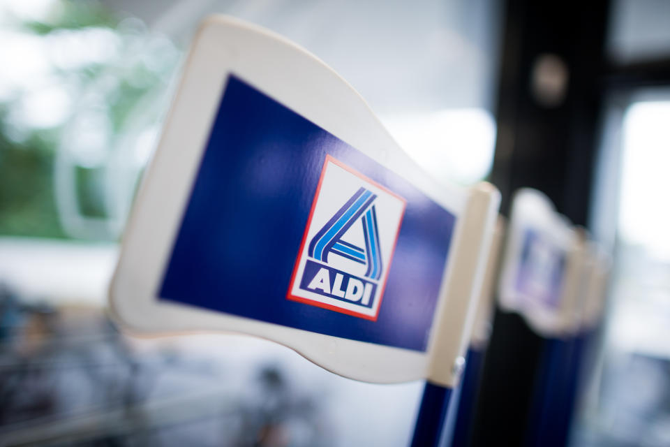 Flags carrying the logo of Aldi Nord seen in a newly designed Aldi Nord store in Gladbeck, Germany, 20 September 2016. Discount supermarket chain Aldi presented the Aldi Nord (lit. Aldi North) supermarket of the future as a blueprint for future stores. Photo: Rolf Vennenbernd/dpa | usage worldwide   (Photo by Rolf Vennenbernd/picture alliance via Getty Images)