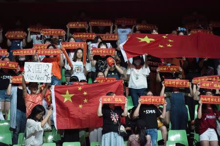 Table Tennis - China Open tournament - Chengdu, China - June 24, 2017 - China's table tennis fans hold up banners to support Liu Guoliang, who has been removed from his coaching place, during the China Open tournament. Picture taken June 24, 2017. REUTERS/Stringer