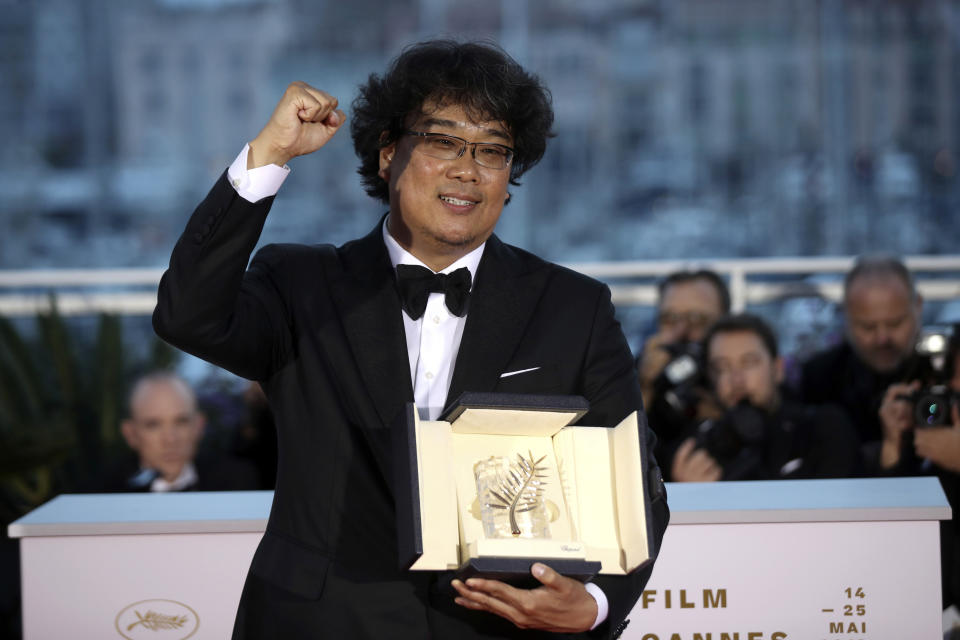 FILE - This May 25, 2019 file photo shows director Bong Joon-ho with the Palme d'Or award for the film "Parasite" during a photo call following the awards ceremony at the 72nd international film festival, Cannes, southern France. The film will release in theaters on Oct. 11. (AP Photo/Petros Giannakouris, File)