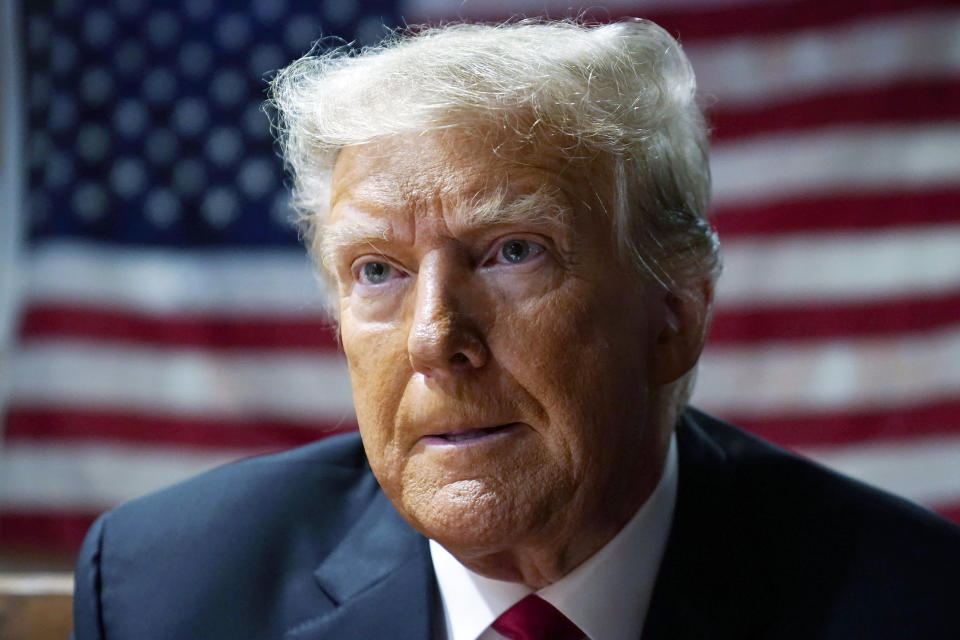 FILE - Former President Donald Trump speaks with supporters at the Westside Conservative Breakfast, June 1, 2023, in Des Moines, Iowa. A federal judge upheld a $5 million jury verdict against Donald Trump on Wednesday, rejecting the former president’s claim that the award was excessive and that a jury in a civil case vindicated him by failing to conclude that he raped a columnist in a luxury department store dressing room in the 1990s. (AP Photo/Charlie Neibergall, File)