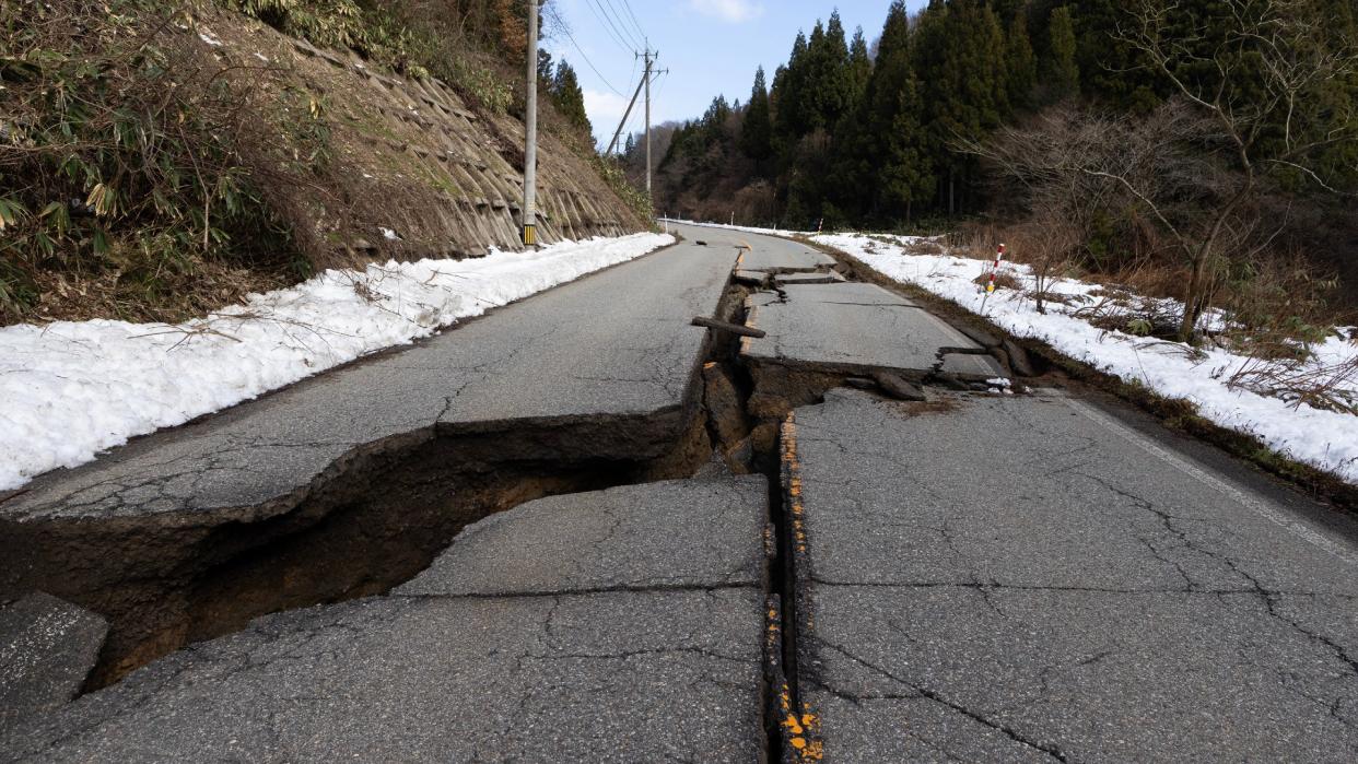  A large crack is seen in a road leading to Wajima, western Japan, on 1 January 2024. 