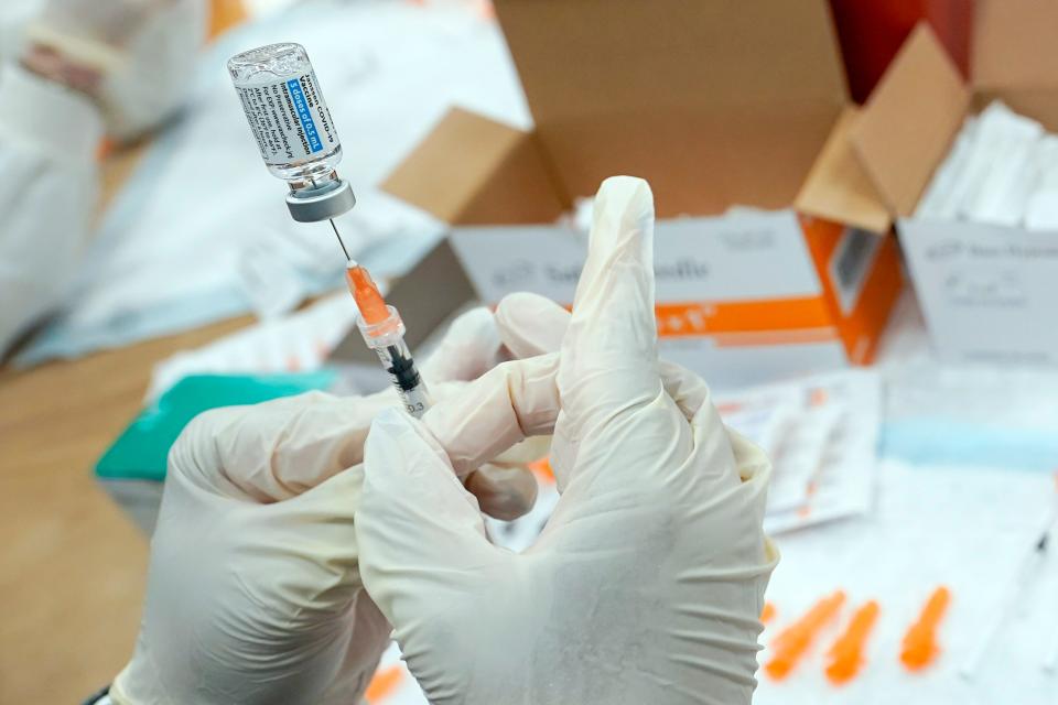 A registered nurse fills a syringe with the Johnson & Johnson COVID-19 vaccine at a pop-up vaccination site in the Staten Island borough of New York, April 8, 2021.