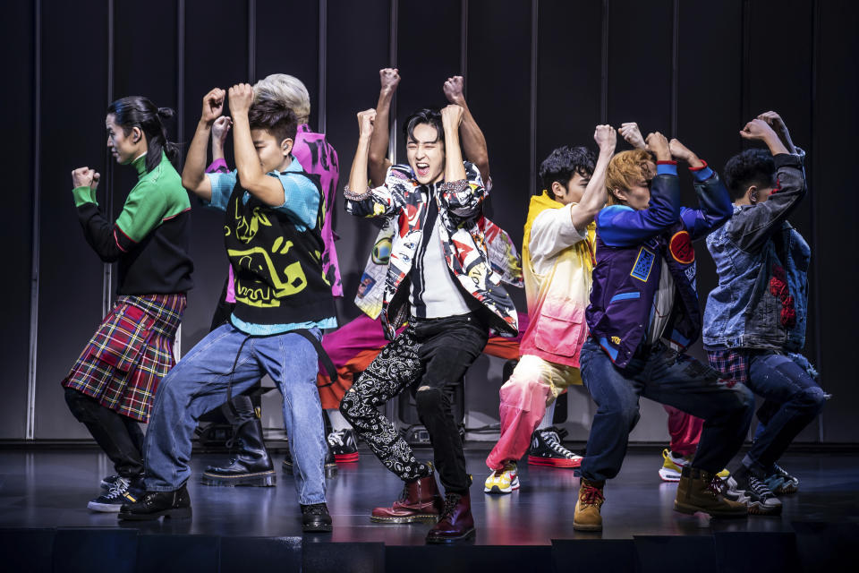 This image released by O+M/DKC shows Kevin Woo, center, and the cast during a performance of “KPOP,” opening Nov. 27 at the Circle in the Square Theatre in New York. (Matthew Murphy/O+M/DKC via AP)