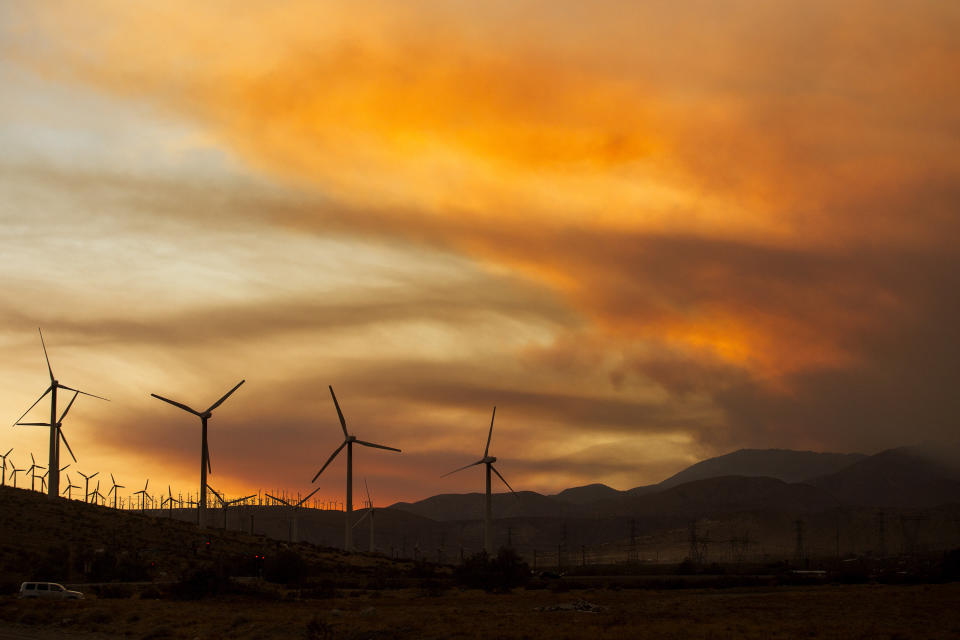 Smoke rise from the Apple Fire during the sunset near Whitewater, Calif., Sunday, Aug. 2, 2020. (AP Photo/Ringo H.W. Chiu)