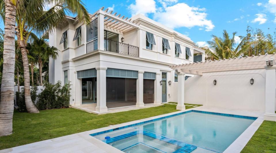 In a duplex, a townhouse at 220 Brazilian Ave. has a loggia with a pergola-topped sundeck above it overlooking the private pool. The townhouse has changed hands for a recorded $14.35 million after selling in January 2023 for $12 million.