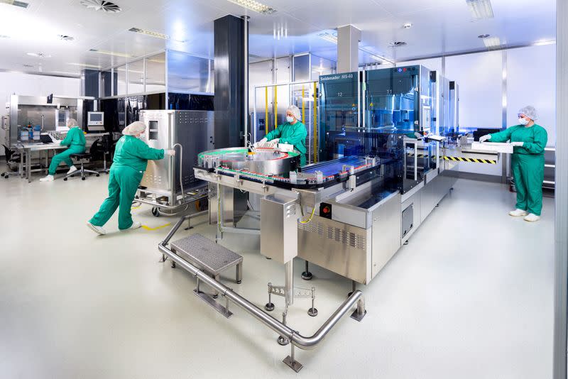 People work at the WuXi Biologics' factory in Leverkusen