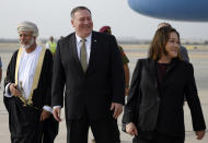 US Secretary of State Mike Pompeo, centre, is greeted by Oman's Minister of Foreign Affairs Yusuf bin Alawi bin Abdullah, left, and US Ambassador to Oman Leslie Tsou, right, upon his arrival in the Oman capital of Muscat, Friday Feb. 21, 2020. (Andrew Caballero-Reynolds/Pool via AP)