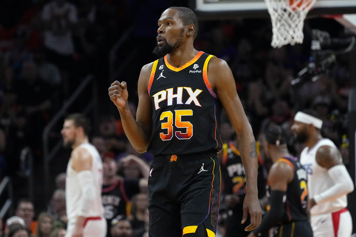 Phoenix Suns forward Kevin Durant (35) celebrates a basket against the Los Angeles Clippers during Game 5 of a first-round NBA basketball playoff series, Tuesday, April 25, 2023, in Phoenix. (AP Photo/Matt York)