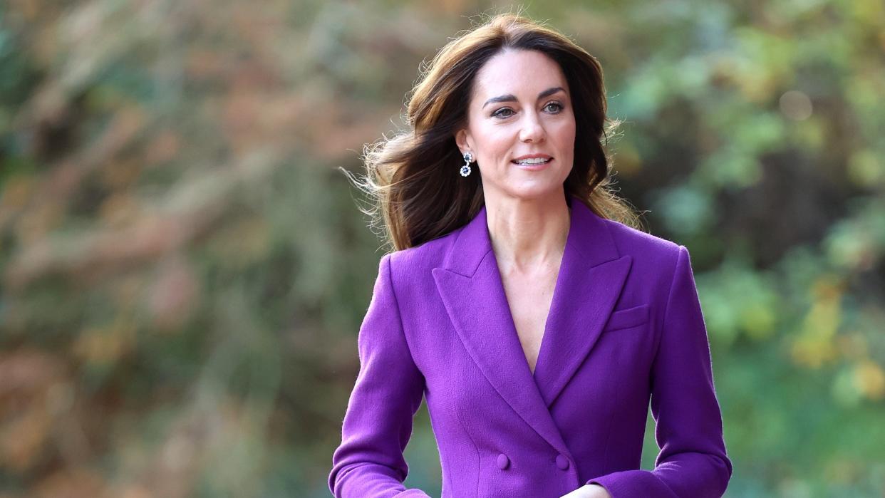  Kate Middleton in a purple blazer . 