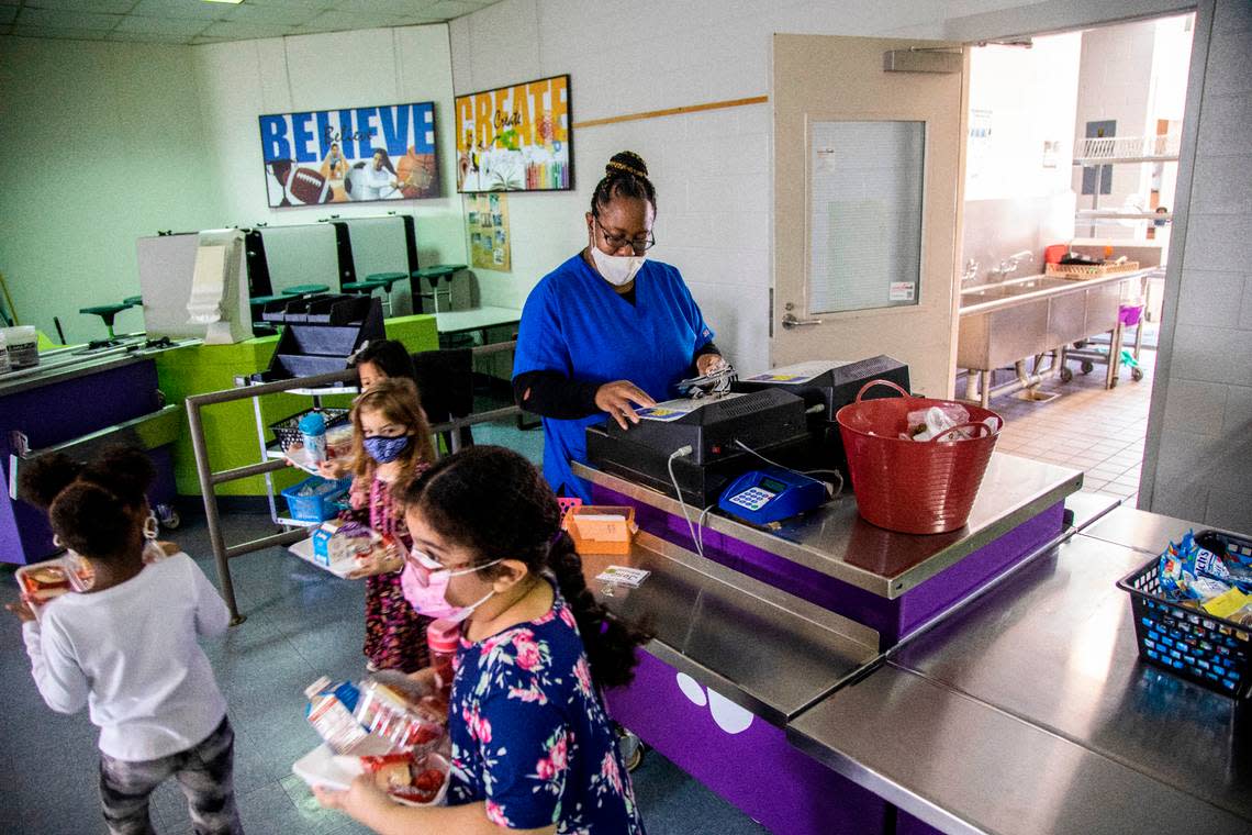 Yolanda Banks serves meals for students at Swift Creek Elementary School in this file photo.