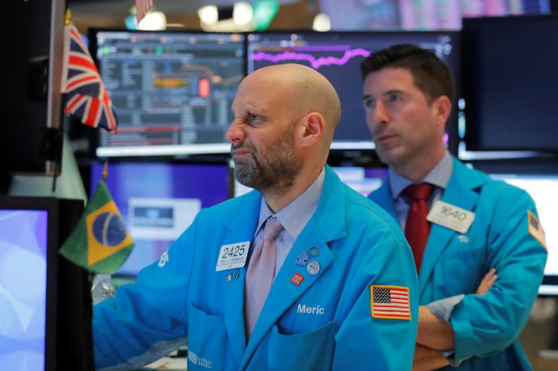 Traders work on the floor of the New York Stock Exchange (NYSE) in New York